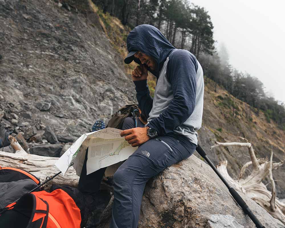 Hiker sitting on a hillside